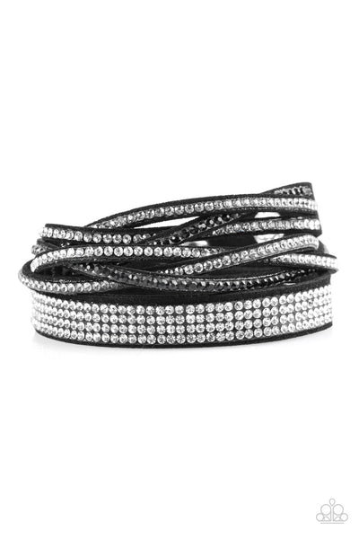 Taking Care Of Business - Black Bracelet - Paparazzi Accessories An elongated black suede band is encrusted in sections of braided white, smoky, and black rhinestones and rows of neatly stacked white rhinestones. The elongated band double wraps around the wrist for a fierce one-of-a-kind look. Features an adjustable snap closure.  Sold as one individual bracelet.  New Kit