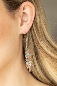 Celestial Chandeliers - Brown Earrings - Paparazzi Accessories Threaded along dainty rods, an iridescent collection of topaz and white crystal-like beads cluster along a silver chain, creating a stellar tassel. Earring attaches to a standard fishhook fitting.  Sold as one pair of earrings.  New Kit