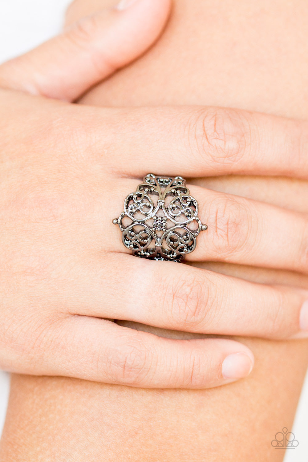 Victorian Valor - Black Ring - Paparazzi Accessories Brushed in a glistening finish, shimmery gunmetal filigree vines curl across the finger, coalescing into an airy frame for a vintage-inspired look. Features a stretchy band for a flexible fit.  Sold as one individual ring.