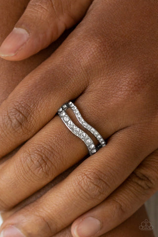 Elite Squad - White Ring - Paparazzi Accessories Varying in size, glittery white rhinestones are encrusted along waving silver bands for a refined look. Features a dainty stretchy band for a flexible fit.  Sold as one individual ring.