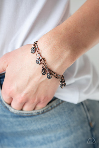 Gypsy Glee - Copper Bracelet - Paparazzi Accessories Glistening copper rods and ornate teardrops link around the wrist in two rows, creating a playful fringe. Features an adjustable clasp closure.  Sold as one individual bracelet.   Get The Complete Look! Necklace: "Galapagos Gypsy - Copper" (Sold Separately)  New Kit