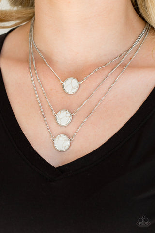 CEO of Chic - White Necklace - Paparazzi Accessories Three flat white stones are pressed into sleek silver frames and layered below the collar for a chic finish. Features an adjustable clasp closure.  Sold as one individual necklace. Includes one pair of matching earrings.