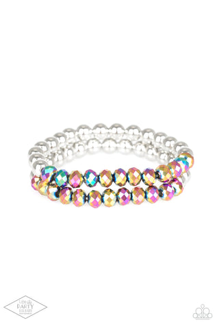 Chroma Color - Multi Bracelet - Paparazzi Accessories Dipped in a rainbow iridescence, a collection of metallic crystal-like beads and shiny silver beads are threaded along two stretchy bands around the wrist for a stellar look.  Sold as one set of two bracelets.  New Kit FANFAVORITE