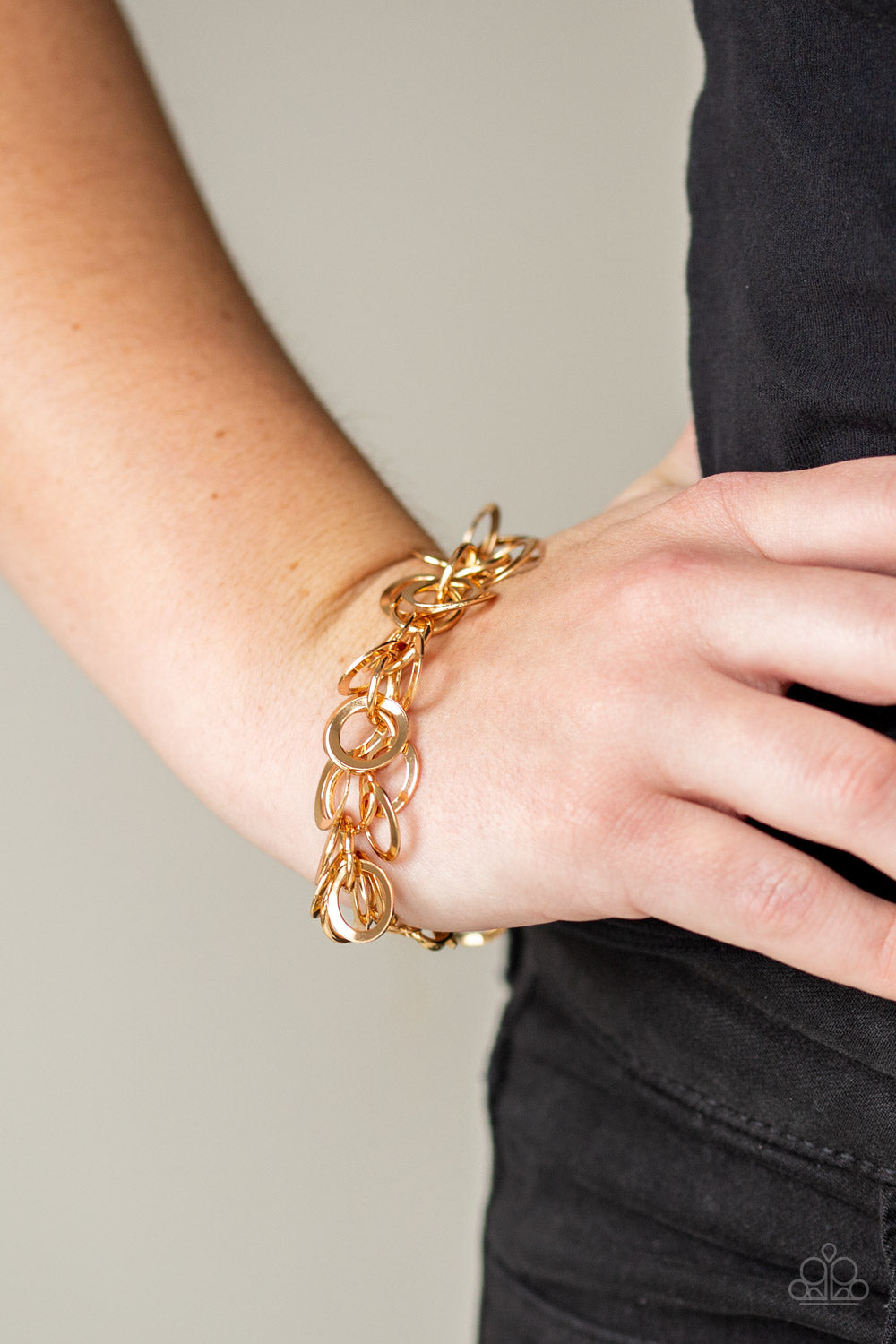 Noise Control - Gold Bracelet - Paparazzi Accessories Countless gold rings dangle from a shimmery gold chain, creating a noisy fringe around the wrist. Features an adjustable clasp closure.  Sold as one individual bracelet.