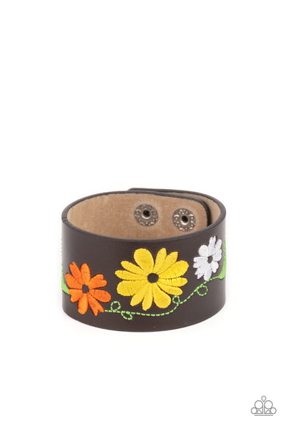 Western Eden - Yellow Bracelet - Paparazzi Accessories A colorful floral pattern is embroidered across the front of a black leather band, creating a whimsical centerpiece around the wrist. Features an adjustable snap closure.  Sold as one individual bracelet.  New Kit