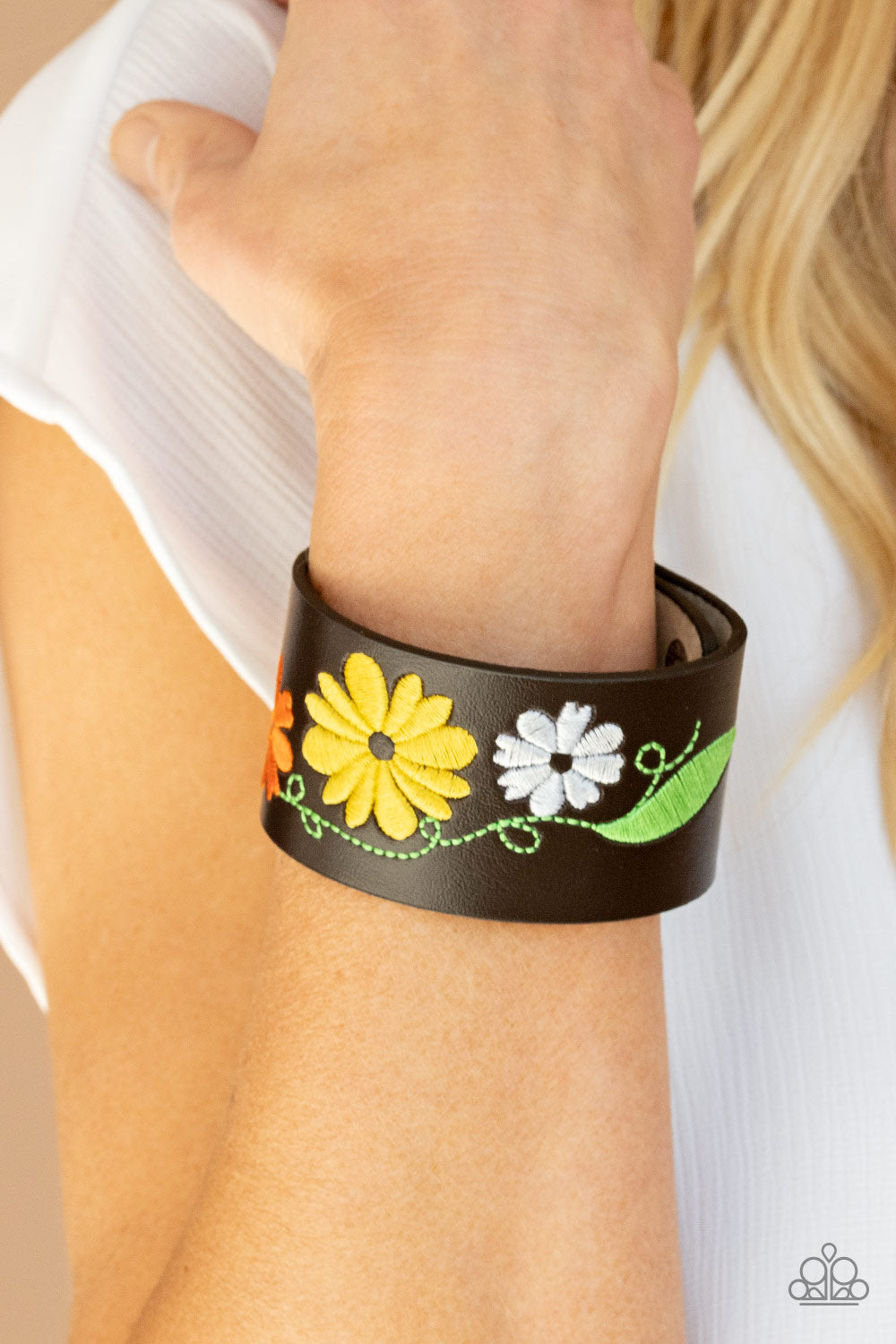 Western Eden - Yellow Bracelet - Paparazzi Accessories A colorful floral pattern is embroidered across the front of a black leather band, creating a whimsical centerpiece around the wrist. Features an adjustable snap closure.  Sold as one individual bracelet.  New Kit