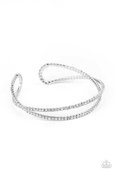 Plus One Status - White Bracelet - Paparazzi Accessories Radiant rows of glassy white rhinestones delicately intertwine into an airy silver cuff around the wrist, creating a glamorous sparkle.  Sold as one individual bracelet.  New Kit