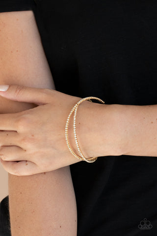 Plus One Status - Gold Cuff Bracelet - Paparazzi Accessories Radiant rows of glassy white rhinestones delicately intertwine into an airy gold cuff around the wrist, creating a glamorous sparkle.  Sold as one individual bracelet.  New Kit