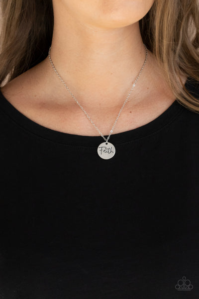 Choose Faith - Silver Necklace - Paparazzi Accessories  A dainty silver disc is stamped in the word, "Faith," at the bottom of a shiny silver chain, creating an inspiring pendant below the collar. Features an adjustable clasp closure.  Sold as one individual necklace. Includes one pair of matching earrings.  New Kit