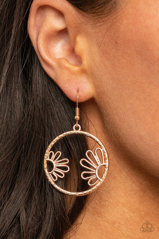 Demurely Daisy - Rose Gold Earrings - Paparazzi Accessories A pair of airy daisies bloom inside a hammered rose gold hoop, creating a whimsically seasonal display. Earring attaches to a standard fishhook fitting.  Sold as one pair of earrings.  New Kit