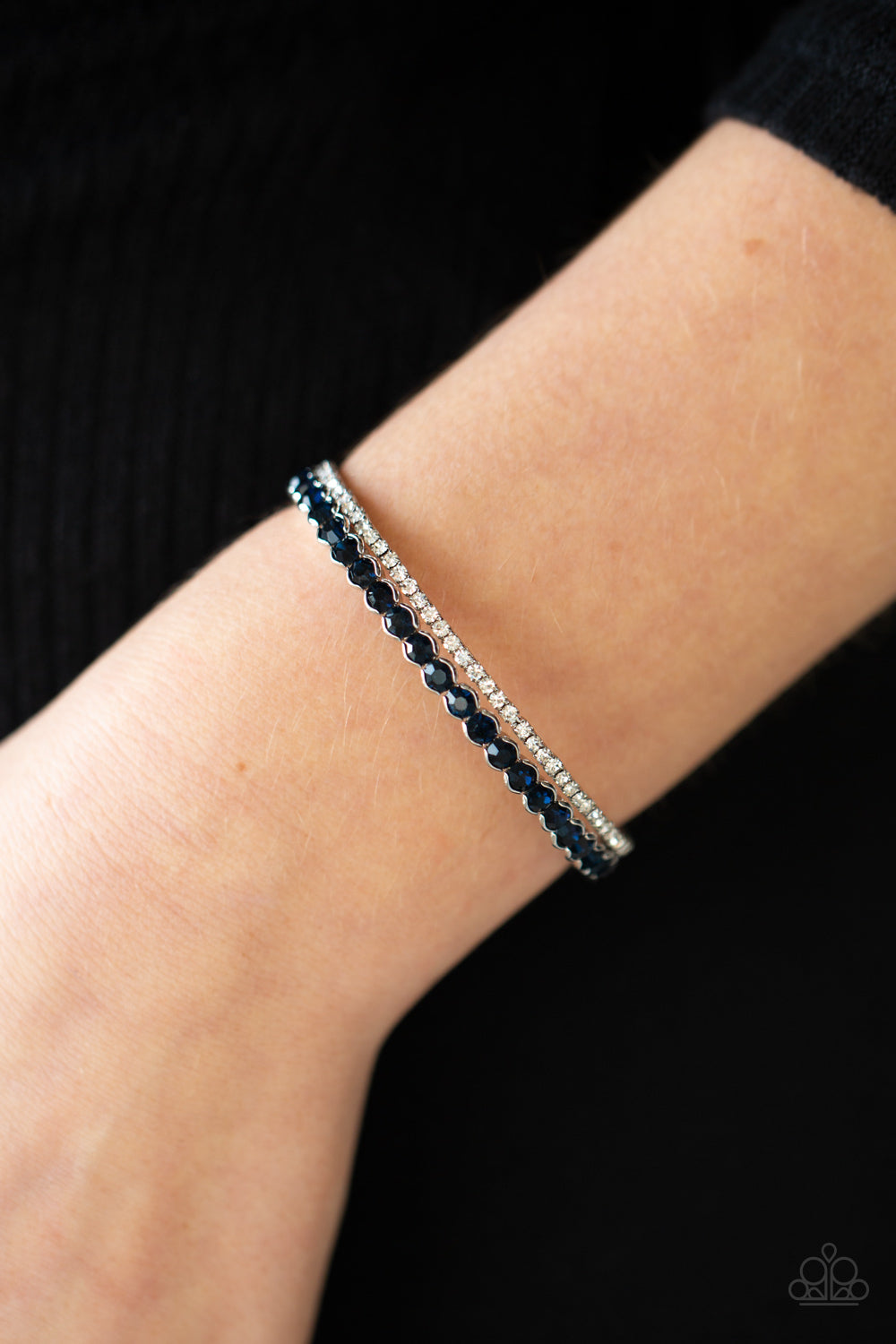 Fairytale Sparkle - Blue Bracelet - Paparazzi Accessories Mismatched strands of glassy white and glittery blue rhinestones stack into a dainty cuff around the wrist, creating a sparkly centerpiece.  Sold as one individual bracelet.  New Kit