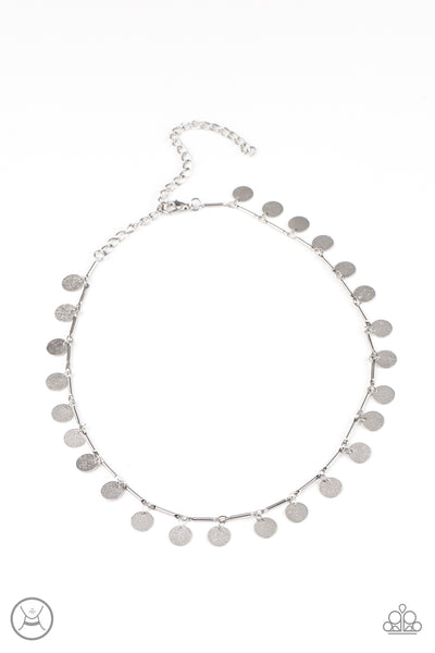 Musically Minimalist - Silver Choker Necklace - Paparazzi Accessories Hammered shiny silver discs swing from interconnected shimmery silver bars around the neck, creating a shimmery fringe. Features an adjustable clasp closure.  Sold as one individual choker necklace. Includes one pair of matching earrings.  New Kit Choker