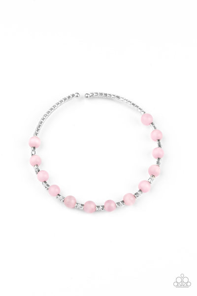 Tea Party Twinkle - Pink Bracelet - Paparazzi Accessories  Glassy pink cat's eye stones are fitted in place along a dainty strand of glassy white rhinestones, creating a twinkly cuff around the wrist.  Sold as one individual bracelet.  New Kit