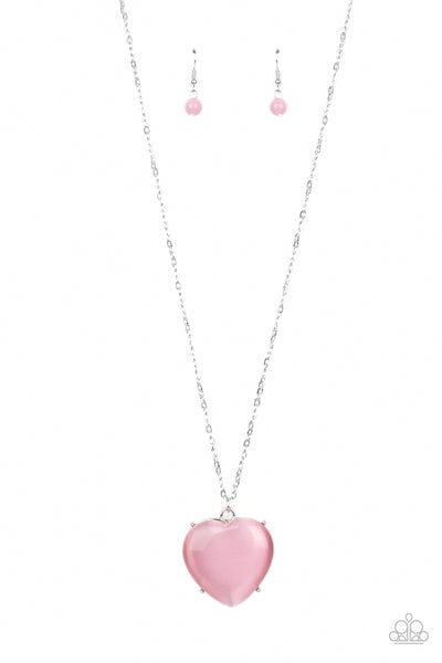 Warmhearted Glow - Pink Necklace - Paparazzi Accessories An oversized pink cat's eye stone frame swings from the bottom of a lengthened silver chain, creating a flirtatious pendant. Features an adjustable clasp closure.  Sold as one individual necklace. Includes one pair of matching earrings.  New Kit