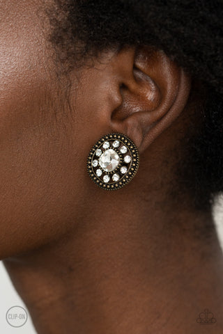 Dazzling Definition - Brass Clip On Earrings - Paparazzi Accessories - Bling On The Jewels By Alyssa and Victoria