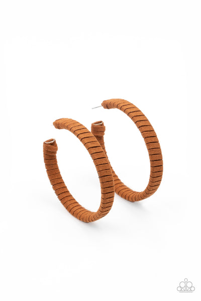 Suede Parade - Brown Earrings - Paparazzi Accessories Tan suede cording wraps around an oversized hoop, creating an earthy pop of color. Earring attaches to a standard post fitting. Hoop measures approximately 2 1/4" in diameter.  Sold as one pair of hoop earrings.  New Kit