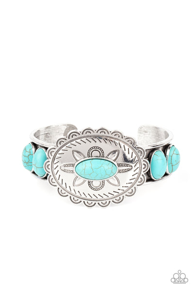 Canyon Heirloom - Blue Bracelet - Paparazzi Accessories Dotted with a refreshing turquoise stone, a floral stamped scalloped silver frame sits atop a turquoise studded silver cuff, creating a southwestern inspired buckle atop the wrist.  Sold as one individual bracelet.  New Kit