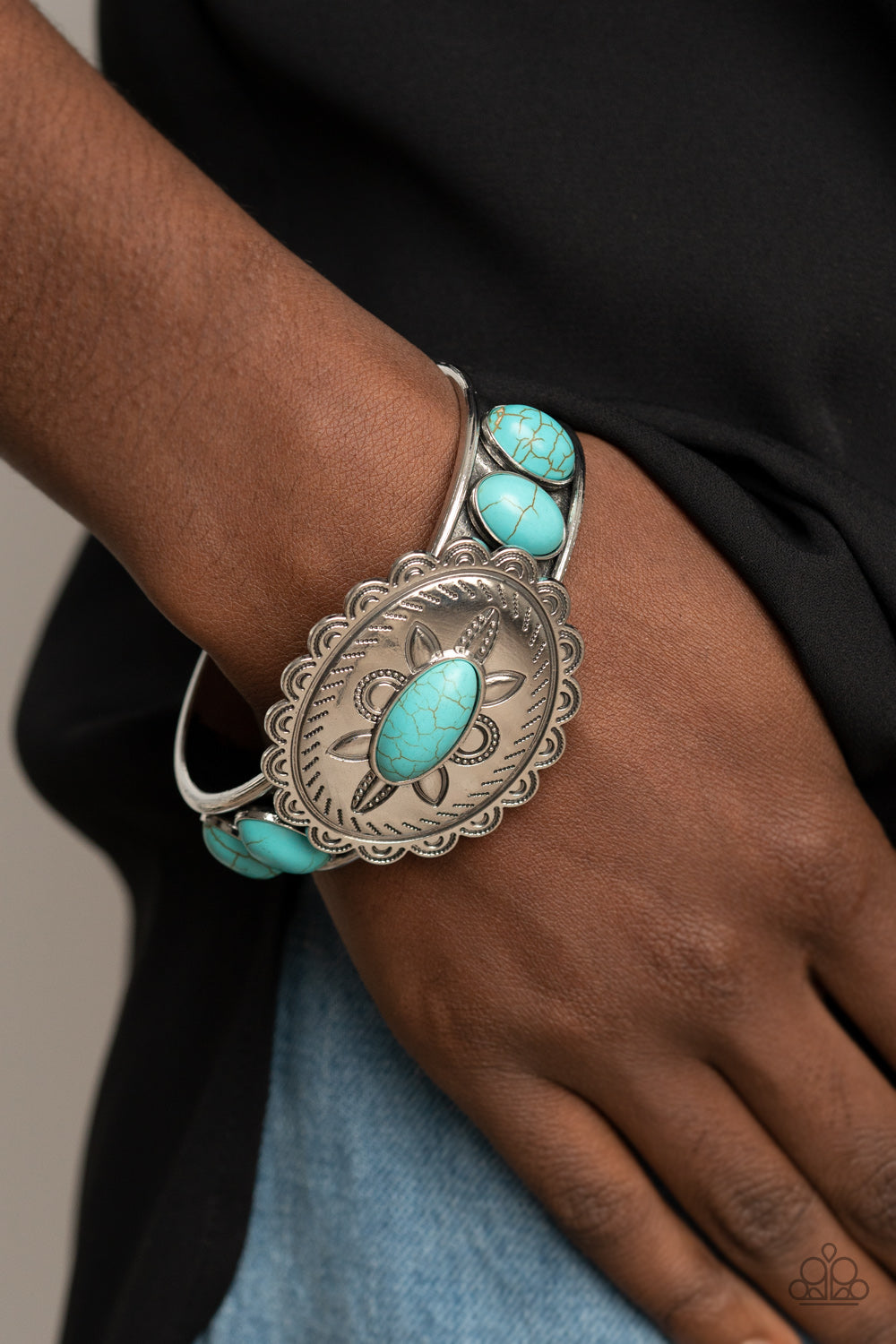 Canyon Heirloom - Blue Bracelet - Paparazzi Accessories Dotted with a refreshing turquoise stone, a floral stamped scalloped silver frame sits atop a turquoise studded silver cuff, creating a southwestern inspired buckle atop the wrist.  Sold as one individual bracelet.  New Kit