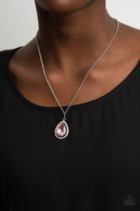 Duchess Decorum - Pink Necklace - Paparazzi Accessories An oversized pink rhinestone teardrop is pressed into the center of a silver frame bordered in white rhinestones, creating a glamorous pendant below the collar. Features an adjustable clasp closure.  Sold as one individual necklace. Includes one pair of matching earrings.  New Kit