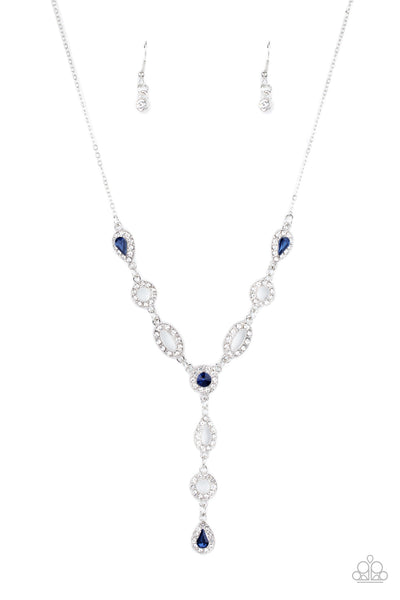 Royal Redux - Blue Necklace - Paparazzi Accessories White rhinestone encrusted oval and teardrop silver frames delicately link with matching blue rhinestone dotted frames below the collar. Matching frames trickle from the center, creating an elegant extended pendant. Features an adjustable clasp closure.  Sold as one individual necklace. Includes one pair of matching earrings.  New Kit