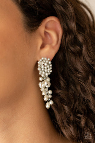 Fabulously Flattering - White Earrings - Paparazzi Accessories Featuring imperfect finishes, a bubbly tassel of white pearls trickles from the bottom of a pearl encrusted silver fitting for a timeless look. Earring attaches to a standard post fitting.  Sold as one pair of post earrings.  New Kit