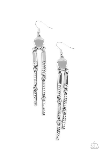 Defined Dazzle - White Earrings - Paparazzi Accessories Sections of dainty white rhinestones are encrusted along the fronts of rectangular silver frames that link from a warped metal fitting, creating an edgy tassel. Earring attaches to a standard fishhook fitting.  Sold as one pair of earrings.  New Kit