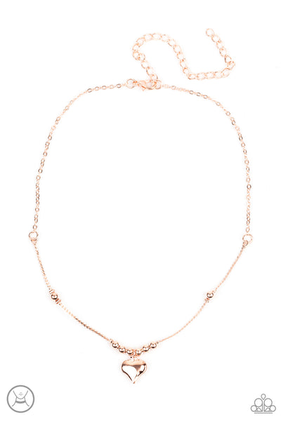 Casual Crush - Rose Gold Choker Necklace - Paparazzi Accessories Infused with dainty rose gold beads, a charming rose gold heart dangles from a wire-like chain around the neck for a flirtatious look. Features an adjustable clasp closure.  Sold as one individual choker necklace. Includes one pair of matching earrings.  New Kit Choker