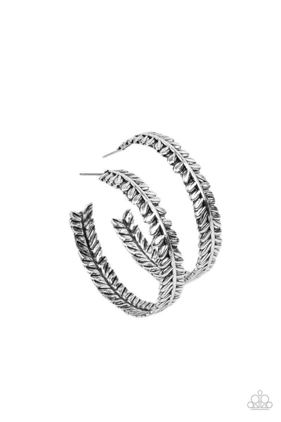 Laurel Gardens - Silver Hoop Earrings - Paparazzi Accessories Brushed in an antiqued shimmer, a leafy silver frame delicately curls into a whimsical hoop. Earring attaches to a standard post fitting. Hoop measures approximately 1 1/4" in diameter.  Sold as one pair of hoop earrings.  New Kit