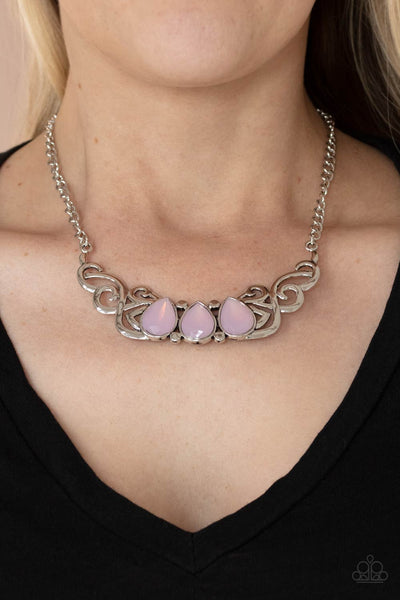 Heavenly Happenstance - Pink Necklace - Paparazzi Accessories Featuring an opaque iridescence, a row of pink teardrop beads are pressed into a studded backdrop of vine-like silver filigree, creating a whimsical centerpiece below the collar. Features an adjustable clasp closure.  Sold as one individual necklace. Includes one pair of matching earrings.  New Kit