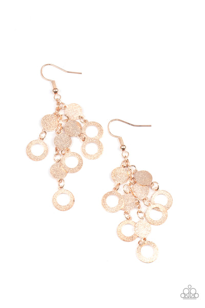 Im Always BRIGHT - Rose Gold Earrings - Paparazzi Accessories Hammered in a high sheen shimmer, dainty rose gold discs and rings cascade from the ear, creating a blinding tassel. Earring attaches to a standard fishhook fitting.  Sold as one pair of earrings.  New Kit