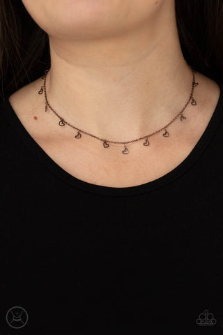 Charismatically Cupid - Copper Choker Necklace - Paparazzi Accessories Dainty heart silhouettes swing from a dainty copper chain around the neck, creating a flirtatious fringe. Features an adjustable clasp closure.  Sold as one individual choker necklace. Includes one pair of matching earrings.  New Kit Choker