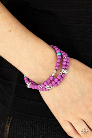 Desert Decorum - Purple Bracelet - Paparazzi Accessories A collection of purple and turquoise stone beads, silver cube beads, and ornate silver accents are threaded along invisible bands around the wrist, creating vivacious layers. Features an adjustable clasp closure  Sold as one individual bracelet.  New Kit