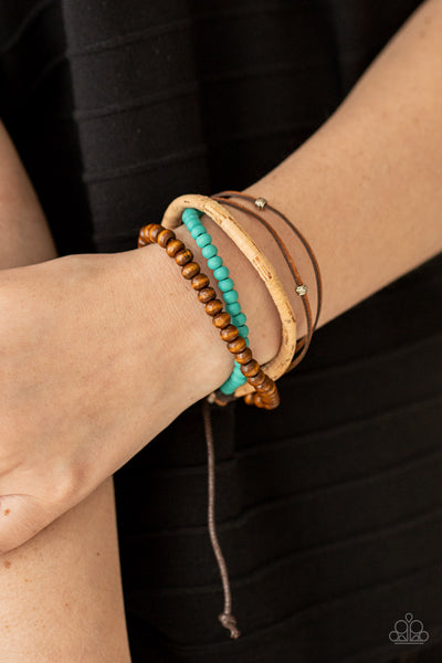 STACK To Basics - Blue Bracelet - Paparazzi Accessories Featuring a strand of turquoise wooden beads, a collection of earthy strands of cork, leather, and wood, comes together for a simple handmade feel as it stacks up the wrist. Features an adjustable sliding knot closure.  Sold as one individual bracelet.  New Kit