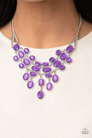 Serene Gleam - Purple Necklace - Paparazzi Accessories A stunning array of oval cut Amethyst Orchid gems, pressed into silver frames, interconnect into a spectacular princess-like bib design. The display rests just below the collar for an exquisitely serene gleam. Features an adjustable clasp closure.  Sold as one individual necklace. Includes one pair of matching earrings.  New Kit