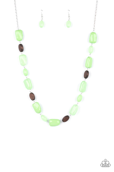 Meadow Escape - Green Necklace - Paparazzi Accessories Varying in opacity, a mixed assortment of faceted Apple Green beads delicately link with dainty wooden beads across the chest, creating a whimsically earthy display. Features an adjustable clasp closure.  Sold as one individual necklace. Includes one pair of matching earrings.  New Kit