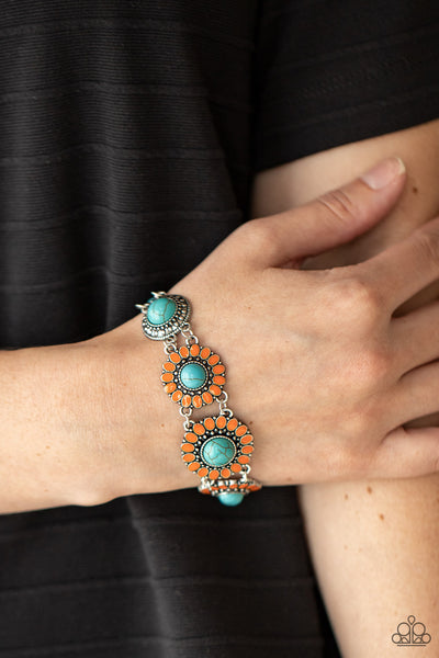 Bodaciously Badlands - Orange Bracelet - Paparazzi Accessories Featuring refreshing turquoise stone centers, studded silver frames double-link with Marigold petaled floral frames around the wrist for a colorfully seasonal look. Features an adjustable clasp closure.  Sold as one individual bracelet.  New Kit