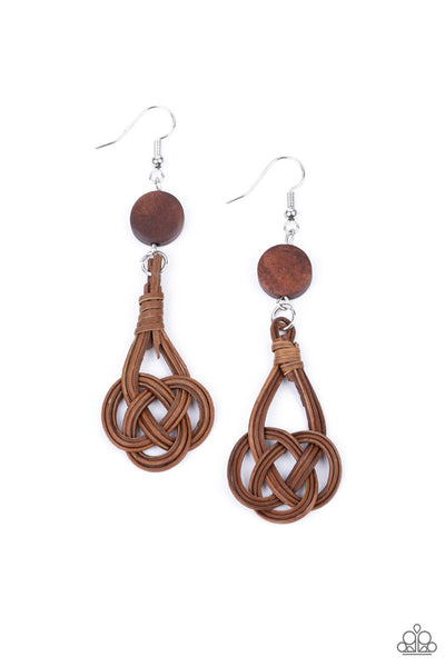 Twisted Torrents - Brown Earrings - Paparazzi Accessories Brown wicker-like laces delicately twist into a knotted frame that attaches to a dainty brown wooden disc, creating an earthy display. Earring attaches to a standard fishhook fitting.  Sold as one pair of earrings.  New Kit