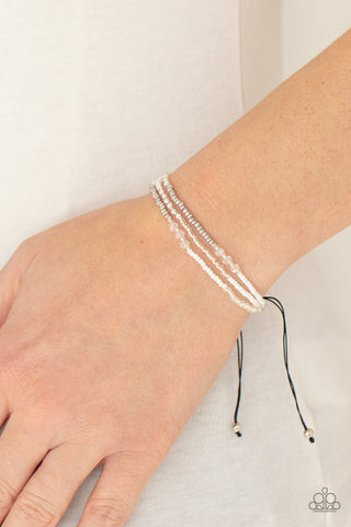 BEAD Me Up, Scotty! - White Bracelet - Paparazzi Accessories Three strands of silver and white micro beads accented with sparkling clear multi-faceted beads give off a space-age vibe. Features an adjustable sliding knot closure.  Sold as one individual bracelet.  New Kit