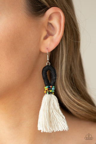 The Dustup - Black Earrings - Paparazzi Accessories A tassel of soft white cotton fans out under rows of brightly colored seed beads. Anchored by a loop of jet black floss, the eye-catching style swings from the ear for a show-stopping statement. Earring attaches to a standard fishhook fitting.  Sold as one pair of earrings.  New Kit