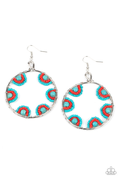 Off The Rim - Blue Earrings - Paparazzi Accessories Red and turquoise seed beads are threaded on wires and looped over turquoise stones on the inside of a spacious silver hoop. The pattern makes its way around the inside of the circle for an around-the-world air. Earring attaches to a standard fishhook fitting.  Sold as one pair of earrings.  New Kit