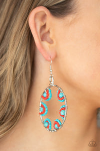 Off The Rim - Blue Earrings - Paparazzi Accessories Red and turquoise seed beads are threaded on wires and looped over turquoise stones on the inside of a spacious silver hoop. The pattern makes its way around the inside of the circle for an around-the-world air. Earring attaches to a standard fishhook fitting.  Sold as one pair of earrings.  New Kit