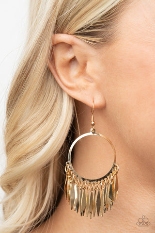Radiant Chimes - Gold Earrings - Paparazzi Accessories Flared flat bars stream out from the bottom of a glistening gold hoop, creating a radiant fringe. Earring attaches to a standard fishhook fitting.  Sold as one pair of earrings.  New Kit
