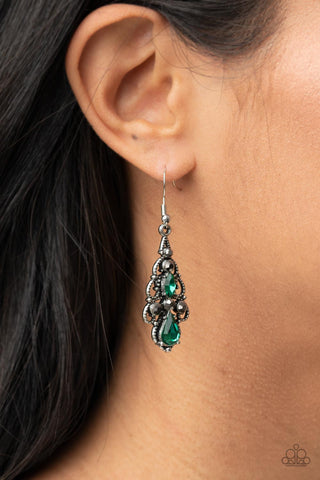 Urban Radiance - Green Earrings - Paparazzi Accessories Embellished in mismatched green and hematite rhinestones, studded silver filigree swirls into an airy chandelier, creating a regal lure. Earring attaches to a standard fishhook fitting.  Sold as one pair of earrings.  New Kit