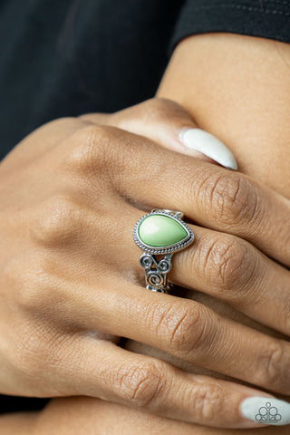 Dreamy Droplets - Green Ring - Paparazzi Accessories A dewy Green Ash teardrop bead is pressed into a delicately braided silver frame. Featuring silver filigree scrolls, an airy band creates a dreamy backdrop for the centerpiece as it sits atop the finger. Features a dainty stretchy band for a flexible fit.  Sold as one individual ring.  New Kit