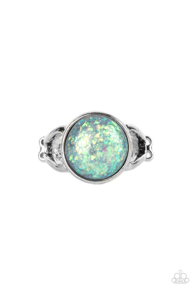 Glitter Grove - Silver Ring - Paparazzi Accessories An opalescent bead flecked with shimmering iridescent glitter is encased in a simple round silver frame creating a dazzling centerpiece atop the finger. Features a dainty stretchy band for a flexible fit.  Sold as one individual ring.  New Kit