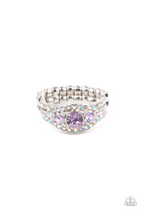 Celestial Crowns - Purple Ring - Paparazzi Accessories A trio of brilliant Amethyst Orchid rhinestones are set inside a glittering rhinestone encrusted frame creating a divinely heavenly essence atop the finger. Features a dainty stretchy band for a flexible fit.  Sold as one individual ring.  New Kit