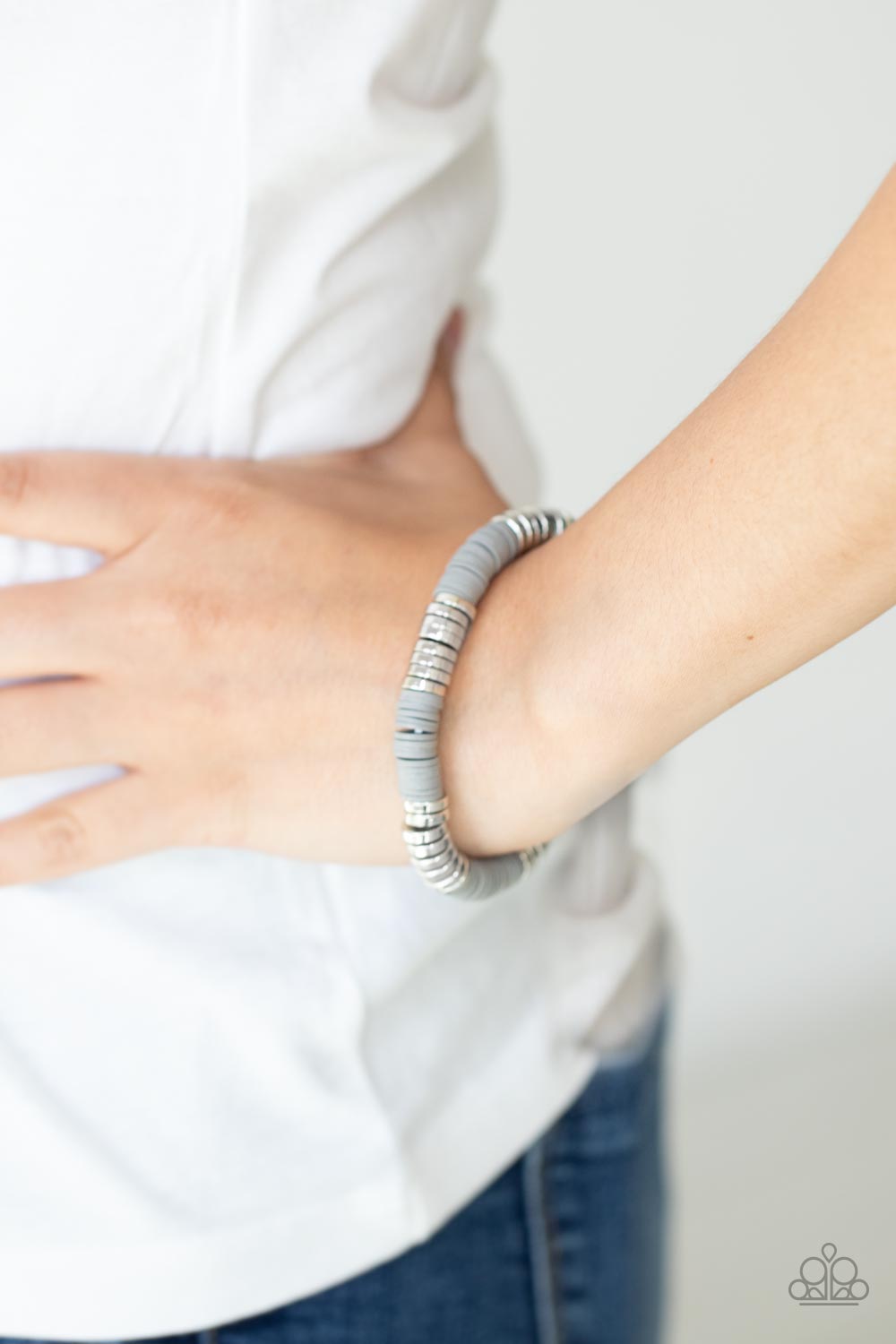 Stacked In Your Favor - Silver Bracelet - Paparazzi Accessories  Stacks of rubbery gray discs and bold silver rings are threaded along a stretchy band around the wrist, creating a versatile pop of color.  Sold as one individual bracelet.  New Kit