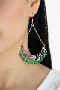 Orchard Odyssey - Green Earrings - Paparazzi Accessories Suspended by two silver chains, a half moon silver frame filled with vine-like filigree gives way to a dainty fringe of glassy Mint teardrop beads for an enchanting fashion. Earring attaches to a standard fishhook fitting.  Sold as one pair of earrings.  New Kit