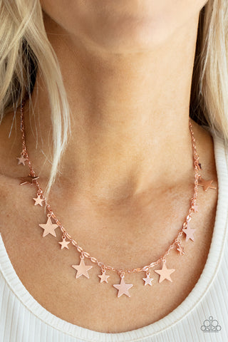 Starry Shindig - Copper Necklace  - Paparazzi Accessories Varying in size, dainty shiny copper stars alternate along a decorative shiny copper chain, creating a stellar fringe below the collar. Features an adjustable clasp closure.  Sold as one individual necklace. Includes one pair of matching earrings.  New Kit