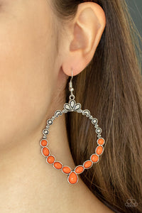 Thai Treasures - Orange Earrings - Paparazzi Accessories Ornate floral motifs decorate the top half of an airy circular silver frame. A row of dewy orange oval and round beads creates a border along the lower half of the frame, culminating in a single teardrop accent for a demurely enchanting lure. Earring attaches to a standard fishhook fitting.  Sold as one pair of earrings.  New Kit